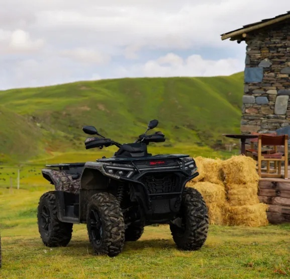 SWM utility ATV parked by hay bales.jpg